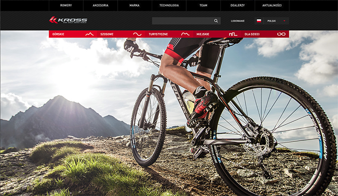 Первый экран интернет-магазина велосипедов. Человек с велосипедом на горе, освещенной солнцем